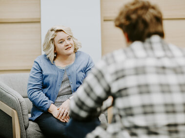 CARE Advocate sitting across from a student