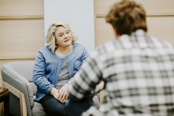 CARE Advocate sitting across from a student